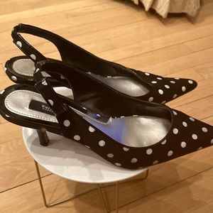 Black and White Poker dot fabric sling back pumps with patent leather heel.